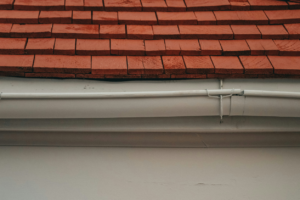 Gutter leaks from weak point in gutter joint.